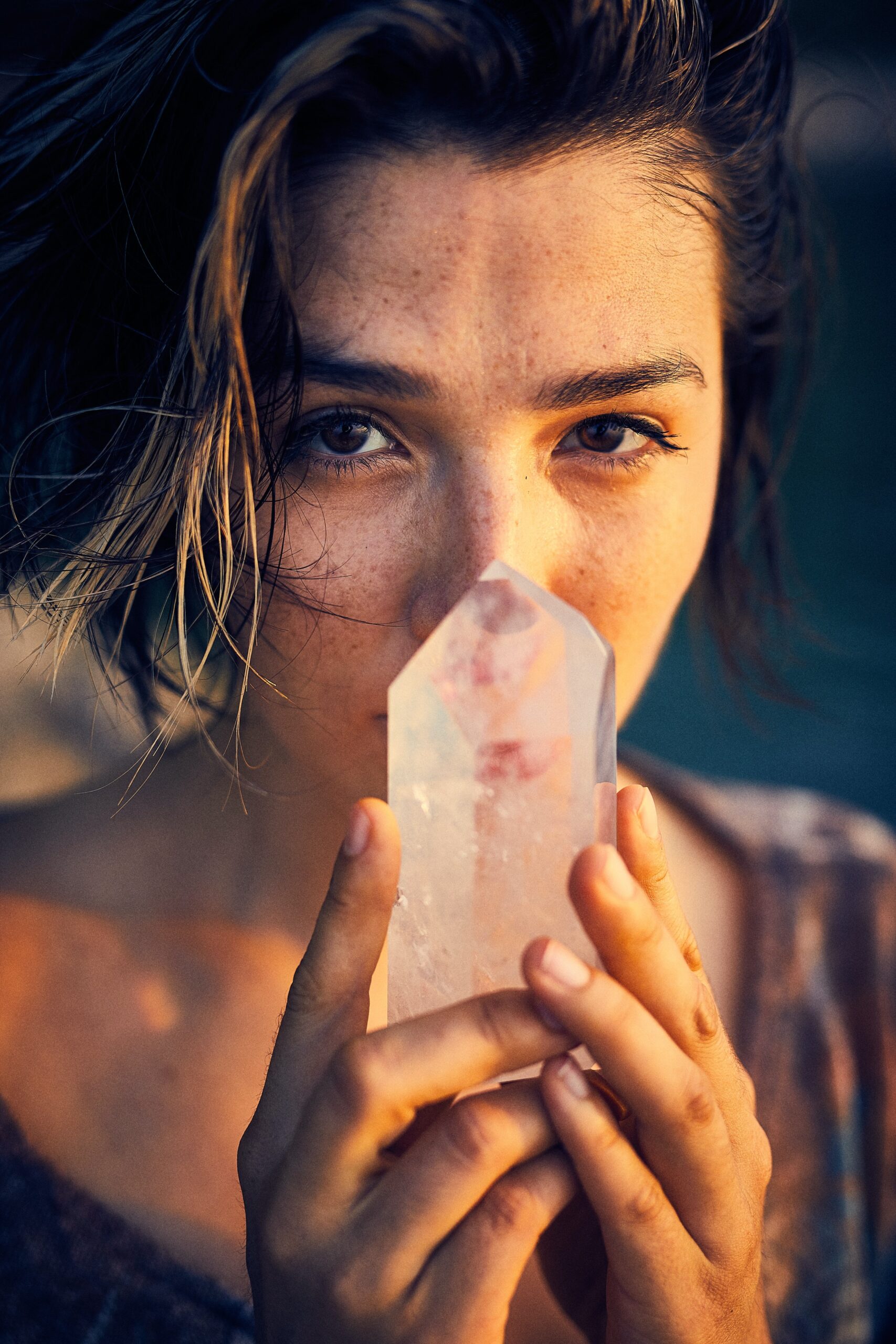 woman holding a spiritual crystal